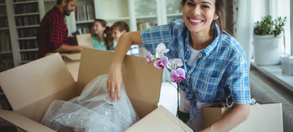 woman in new home unpacking 