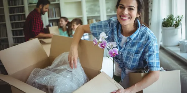 woman in new home unpacking 